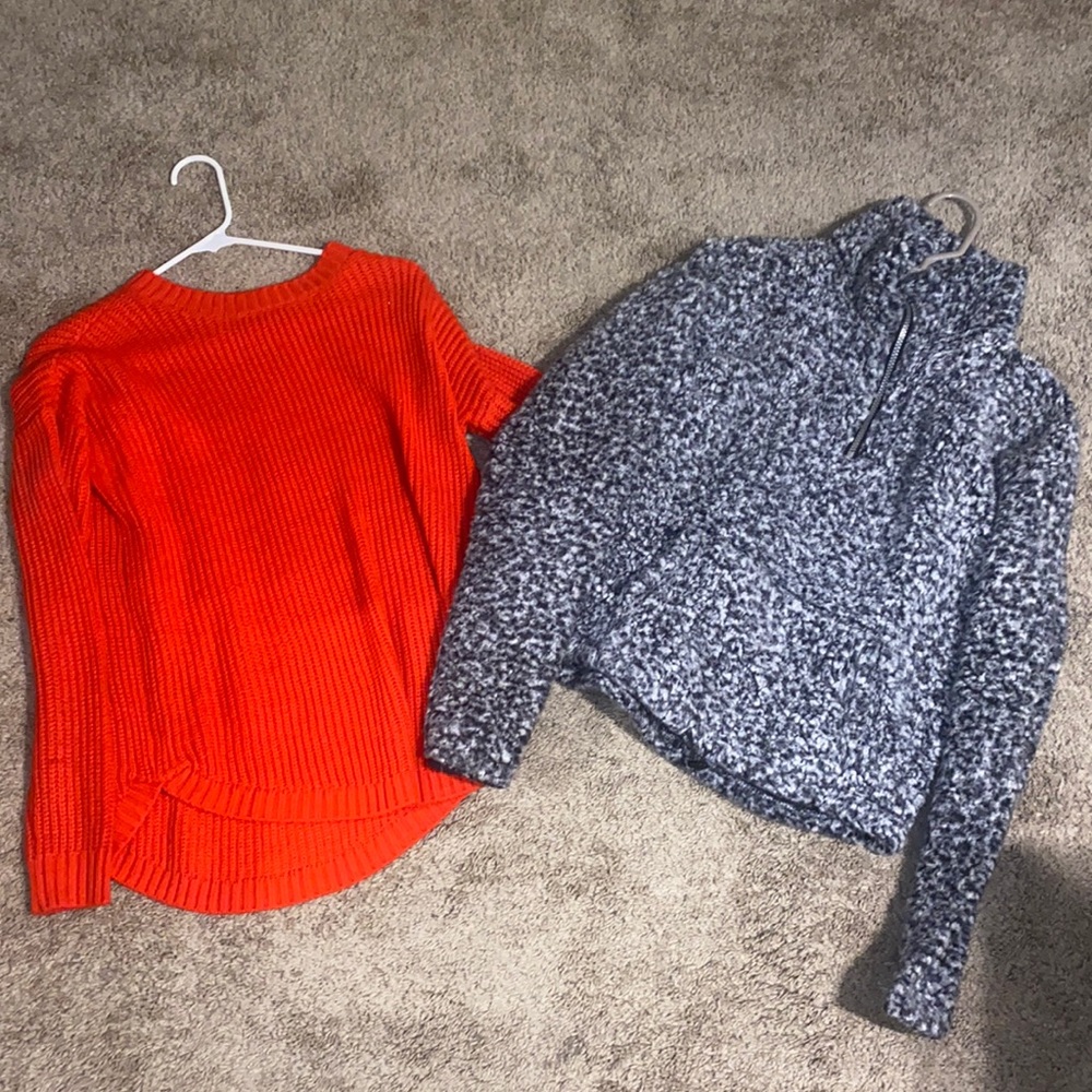 two sweaters made by the same company. both are in a size medium.